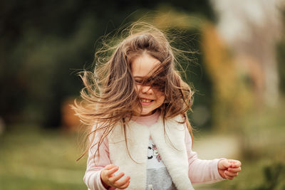 Portrait of smiling girl outdoors