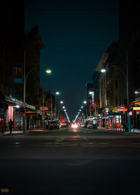 Illuminated street at night