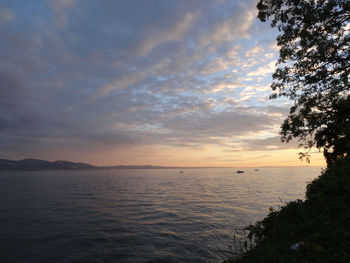 Scenic view of sea against sky at sunset