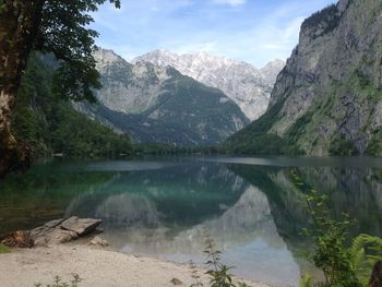 Scenic view of lake and mountains against sky