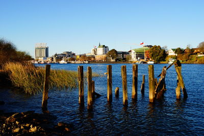 View of buildings against clear blue sky