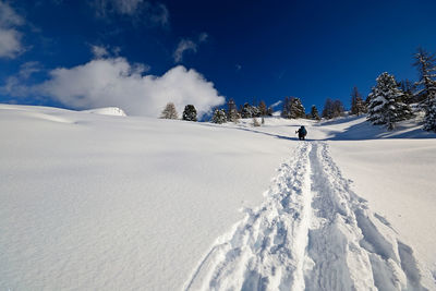 Scenic view of snow covered mountain against sky