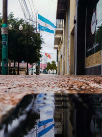 Road by buildings in city