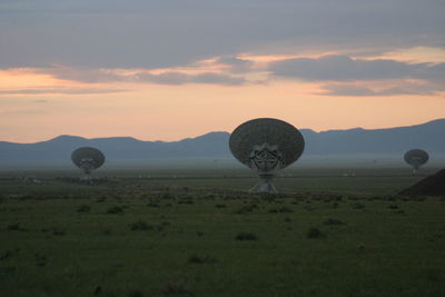 Scenic view of field against sky during sunset