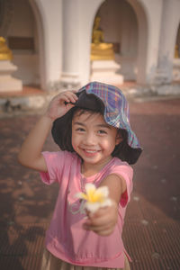 Portrait of a cute lttle girl with flower