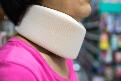 Close-up side view of woman wearing whiplash