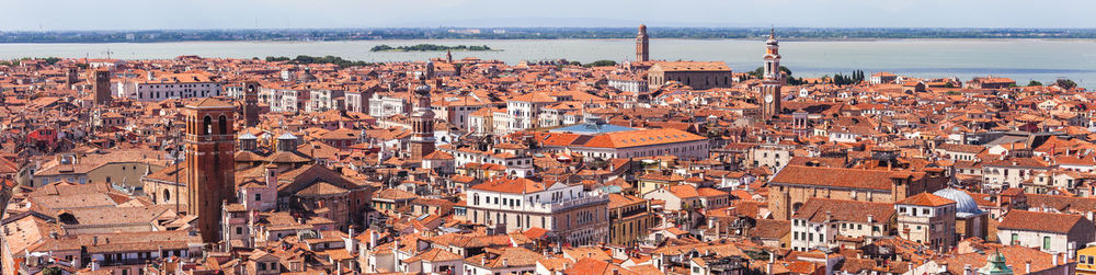 Aerial panoramic view of red roofs of venice, sights of the old city of venice, long banner