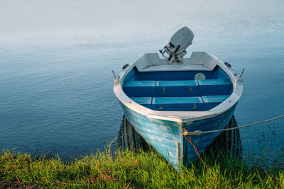 Docked blue fishing boat
