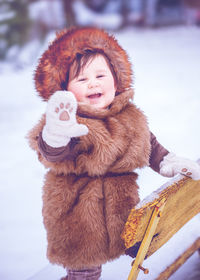 Cute girl smiling in snow