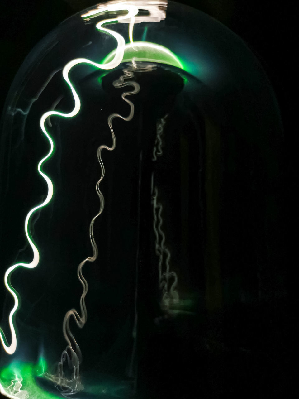 CLOSE-UP OF ILLUMINATED LIGHT PAINTING ON WALL