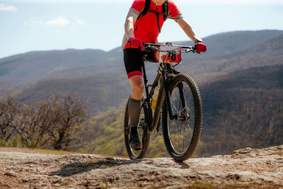 Man riding bicycle on road