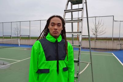 Portrait of teenage boy standing on the ground