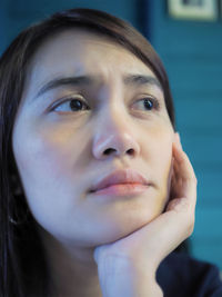 Close-up of thoughtful woman looking away