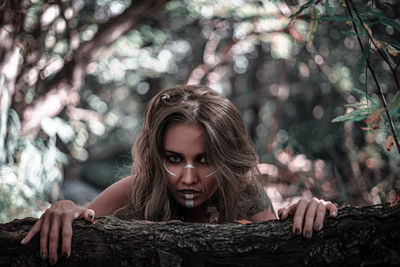 Portrait of a young woman in forest