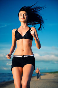 Woman jogging at beach