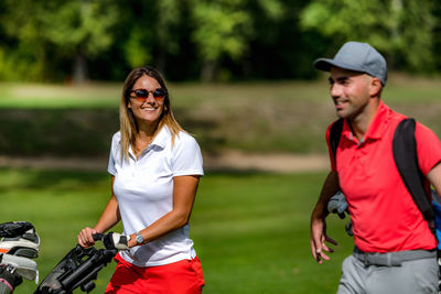 Golfing couple enjoying a game on a golf course