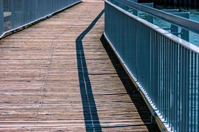 High angle view of wooden footbridge