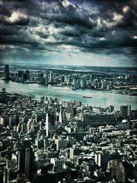 Cityscape against cloudy sky