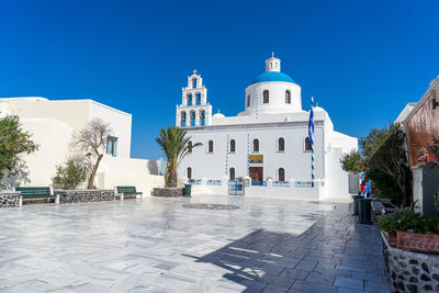 Orthodox church in oia, santorini, greece on a summer day. summer 2020, during coronavirus pandemic