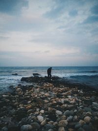 Scenic view of sea against cloudy sky