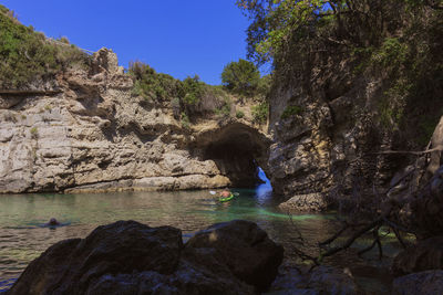 Scenic view of river amidst rock formation