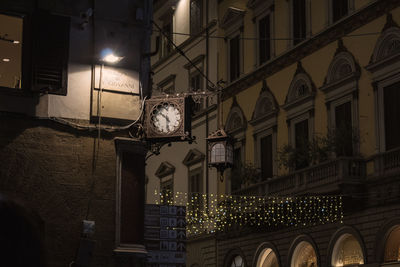 Low angle view of illuminated buildings at night