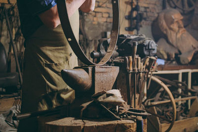 Low section of man working in workshop