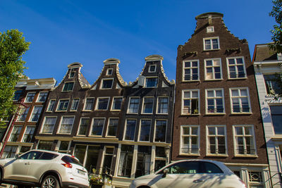 Low angle view of building against blue sky