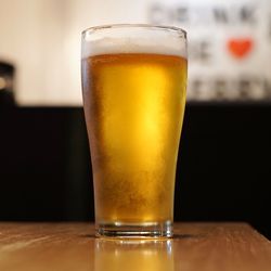 Close-up of beer glass on table