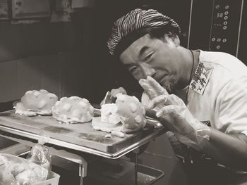 Portrait of baker making desserts in bakery