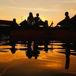 Silhouette people at sunset