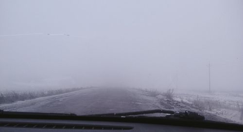 Scenic view of snow covered landscape against sky