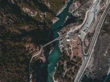 High angle view of bridge over river against trees