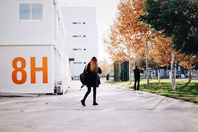 People walking on road in city