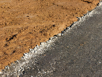 High angle view of tire tracks on road