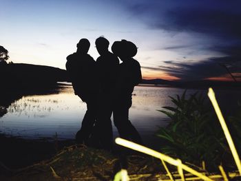 Silhouette of people at sunset