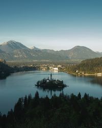 Scenic view of lake and mountains against sky