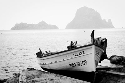 Boat on beach against sky