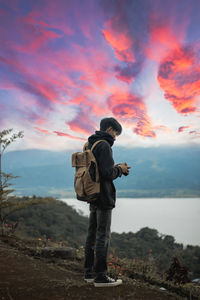 Man watching the sunset on the lake singkarak