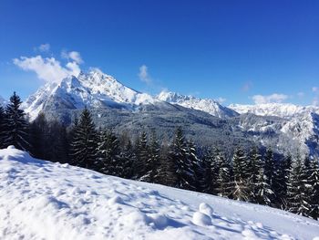 Scenic view of snowcapped mountains against sky