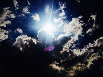 Low angle view of sun in sky