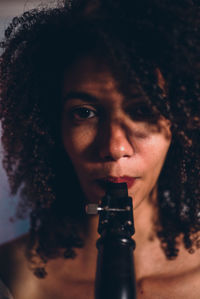 Close-up of young woman with curly hair