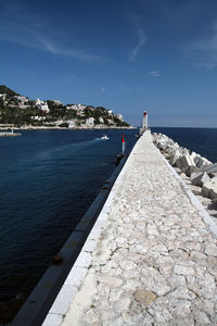 Scenic view of sea against blue sky