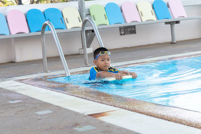 Boy swimming in pool