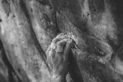 Cropped image of person rock climbing