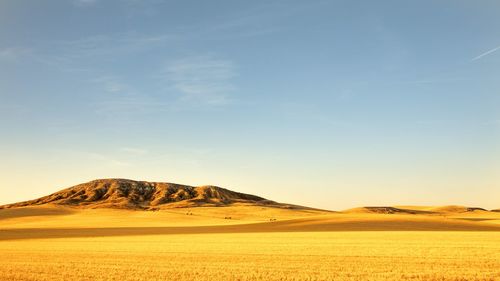 Scenic view of desert against sky