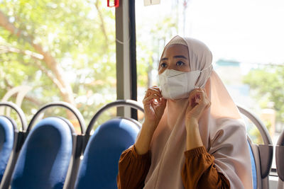 Young woman wearing mask