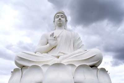 Low angle view of statue against sky