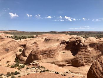 Rock formations in desert against sky