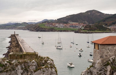 High angle view of sailboats in bay